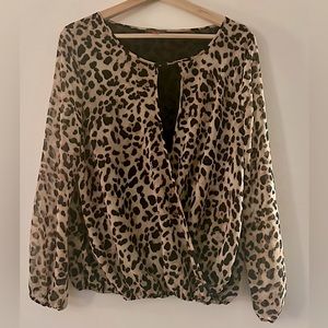 Vince Camuto animal print blouse with cut away detail.